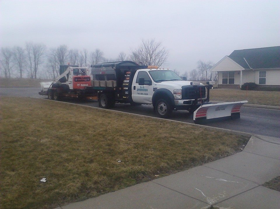 BLIZZARD® POWER PLOW™ with an ICE CHASER™ Hopper Spreader